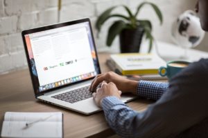 photo of someone using a laptop to access training